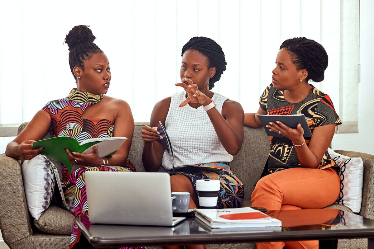 3 Women of Management Consulting For Nonprofits And Investors sitting on a couch having conversation